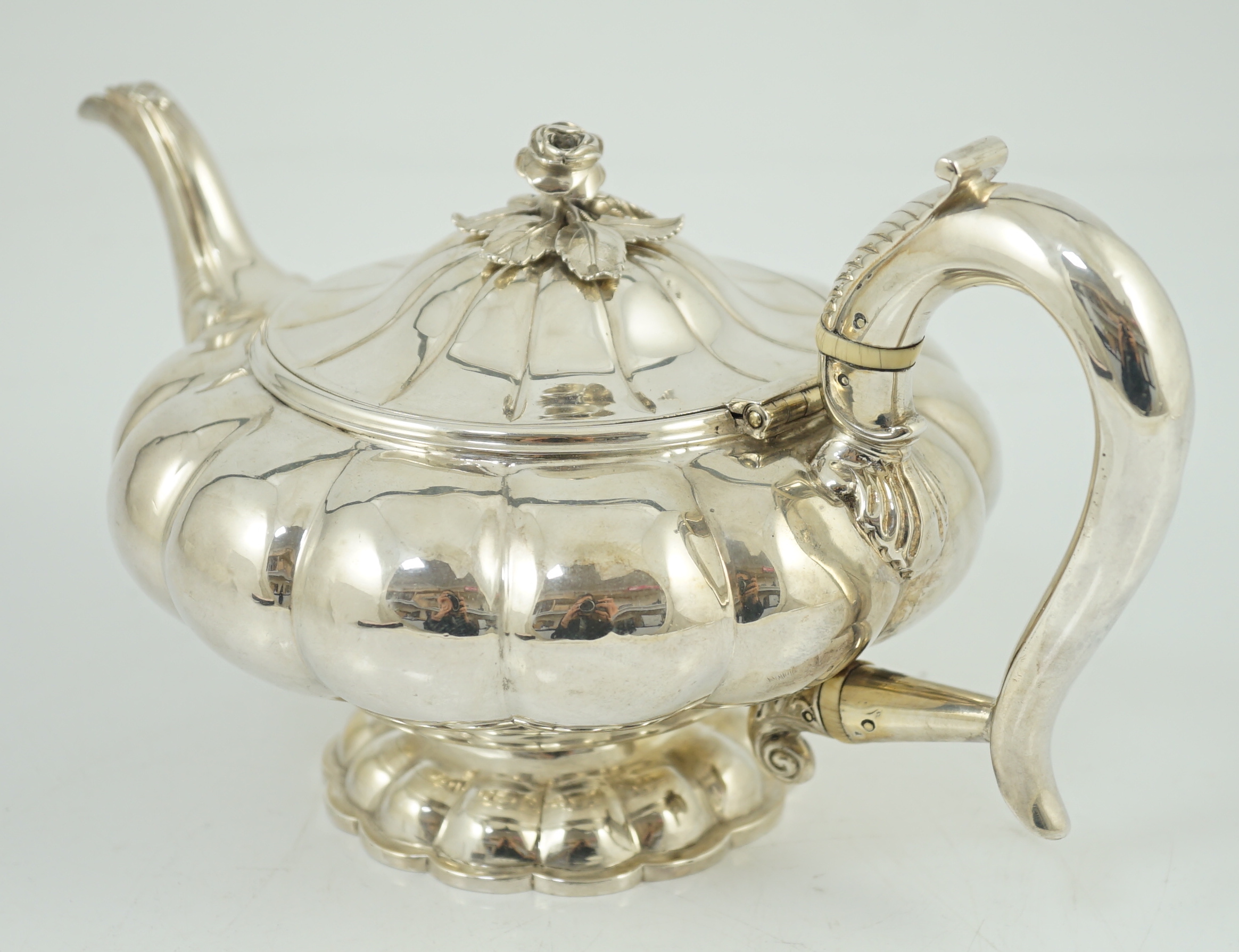 A George IV silver melon shaped pedestal teapot, by Joseph Angell I